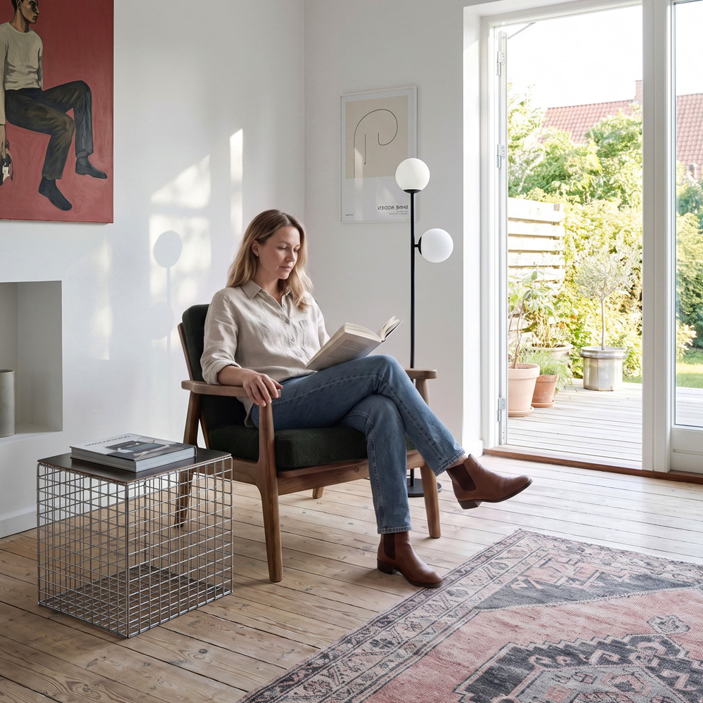 Armchair in a scandinavian interior with a person, generated with Sopla.app